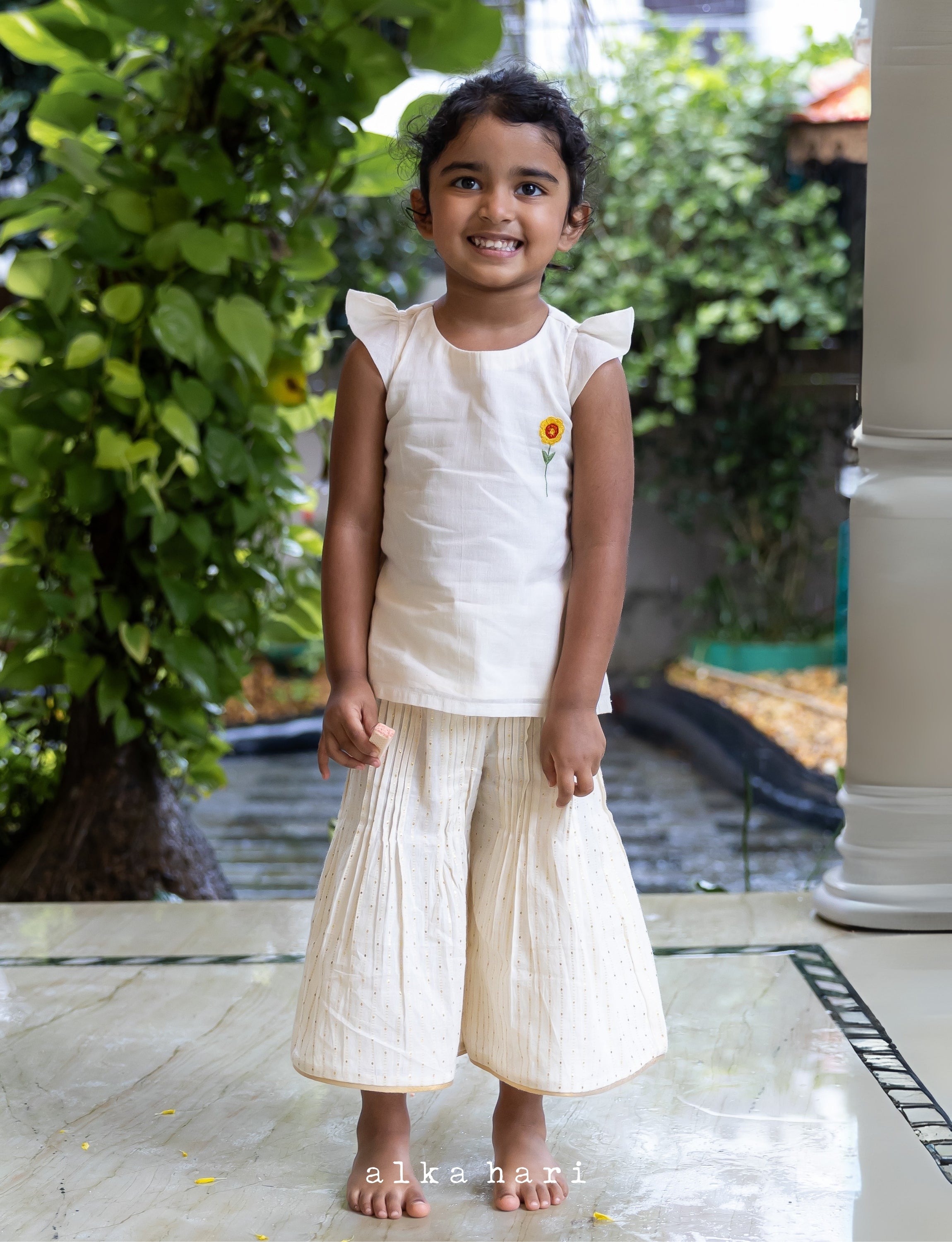 Flower Embroidered Off White Kurta with Flared Bottom